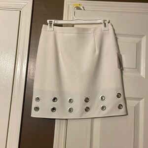 Cream skirt with large grommets